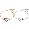 Two friendship bracelets, one silver with purple heart and infinity loop in middle, the other is a gold bracelet with pink heart and infinity loop in middle of heart